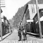 This 1904 photo shows the original portion of the ornate Valentine Building. The view looks up wooden-planked Seward Street. Pioneer builder, jeweler and civic leader Emery Valentine expanded the building in 1912-1913 into what we see today at the corner of Front and Seward streets. The joining point of old and new structures is located at the Rookery Cafe. (Courtesy Photo / Alaska State Library, Historical Collection, Juneau Business Core File, P 01-1466)