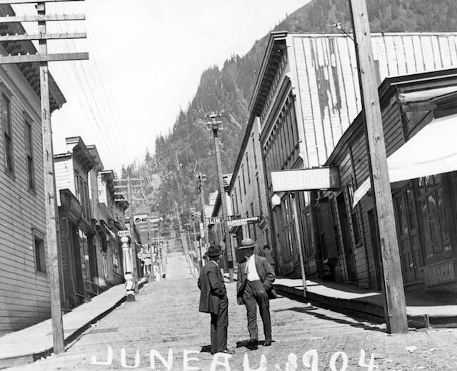 This 1904 photo shows the original portion of the ornate Valentine Building. The view looks up wooden-planked Seward Street. Pioneer builder, jeweler and civic leader Emery Valentine expanded the building in 1912-1913 into what we see today at the corner of Front and Seward streets. The joining point of old and new structures is located at the Rookery Cafe. (Courtesy Photo / Alaska State Library, Historical Collection, Juneau Business Core File, P 01-1466)