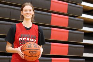 JDHS senior and team captain Skylar Tuckwood poses for a photo during a practice ahead of the Region V Tournament. Though the Crimson Bears were eliminated, the team secured an at-large bid to enter into the state championship this year in Anchorage. (Jonson Kuhn / Juneau Empire)