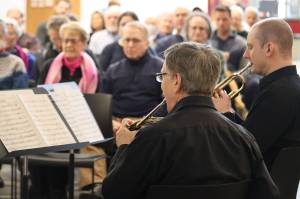 Juneau Brass Quintet co-founding member Bill Paulick along with Stephen Young performs Shepherds Hey to a packed house at the Alaska State Museum on Saturday as part of the quintets season-ending performance. Friends of the Alaska State Library, Archives and Museum sponsored the event with proceeds going to the musicians and FoSLAM. (Jonson Kuhn / Juneau Empire)