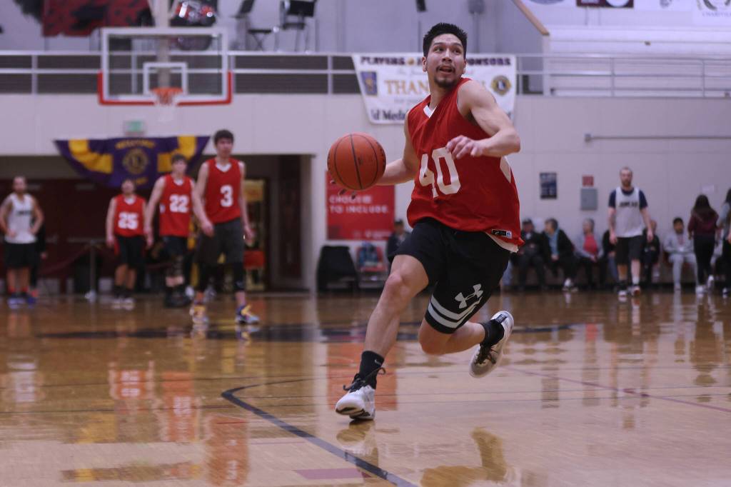 Kakes Simon Friday (40) makes his down the court to take a shot at the basket with time expiring in the second half in a losing effort against Juneau in the first B Bracket game of this years Gold Medal Basketball Tournament. (Ben Hohenstatt / Juneau Empire)