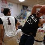 MMetlakatlas Michael Henderson reaches for the ball Sunday afternoon in the second B Bracket game of the 74th Juneau Lions Club Gold Medal Basketball Tournament. (Clarise Larson / Juneau Empire)