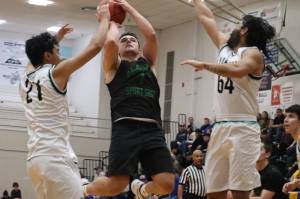 K. Santo Franks of team Haines puts up a 2-point shot against Yakutat on Sunday night during this years Gold Medal Basketball Tournament at JDHS. Franks led his team in points for a total of 14. (Jonson Kuhn / Juneau Empire)