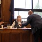 Rep. DeLena Johnson, R-Palmer, center, discusses details of the proposed state budget for next year as modified by the House Finance Committee she co-chairs with Reps. Neil Foster, D-Nome, left, and Bryce Edgmon, I-Dillingham. Assisting Johnson is her chief of staff Remond Henderson. (Mark Sabbatini / Juneau Empire)