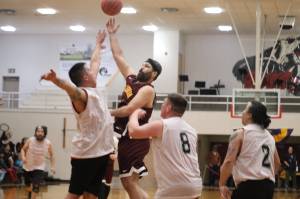 Kent Larson takes a hookshot against Kake on Monday morning as part of the C Bracket in this years Gold Medal basketball tournament. Larson finished the game with 13 points in the Klukwan win. (Jonson Kuhn / Juneau Empire)