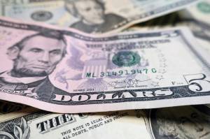 Alaskas state legislators are slated to get the equivalent of 6,720 additional $5 bills in their salary next year via a $33,600 raise to a total of $84,000 due to a veto Monday by Gov. Mike Dunleavy of bill rejecting raises for legislative and executive branch employees. (AP Photo/Ted Shaffrey, File)