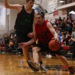 Hydaburgs George Peratrovich drives along the baseline while defended by Haines Tyler Swinton (44) early in Hydaburgs 75-57 win Monday night. Swinton led all scorers with 28 points, doing much of his damage in the second quarter. Peratrovich game down with 10 boards in the contest, which helped cinch the win. (Ben Hohenstatt / Juneau Empire)