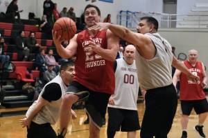 Klukwans Russ Stevens (23) scores against Hoonahs Michael Mills (1) during Masters Bracket action in the Gold Medal Basketball Tournament, Monday, March 20, at Juneau-Douglas High School: Yadaa.at Kalé. (Klas Stolpe/For the Juneau Empire)