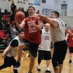 Klukwan's Russ Stevens (23) scores against Hoonah's Michael Mills (1) during Masters Bracket action in the Gold Medal Basketball Tournament, Monday, March 20, at Juneau-Douglas High School: Yadaa.at Kalé. (Klas Stolpe/For the Juneau Empire)