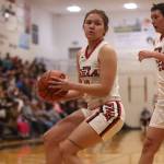 Hoonahs Alona Howland corrals a loose ball with teammate Olivia Morrison (23) not far behind during the first quarter of an eventual loss to Prince of Wales. (Ben Hohenstatt / Juneau Empire)