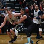 Filcoms Tom Gisler dribbles under pressure from Hoonahs Anthony Lindoff during C Bracket action in the Gold Medal Basketball Tournament, Monday, March 20, at Juneau-Douglas High School: Yadaa.at Kalé. (Klas Stolpe/For the Juneau Empire)