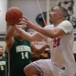 Hoonahs Travis Dybdahl puts the ball up for an easy layup against Yakutat on Tuesday in the C Bracket of this years Gold Medal basketball tournament. Dybdahl finished the game with a total of 17 points. With Hoonahs Tuesday win, Yakutat is now eliminated from the tournament. (Jonson Kuhn / Juneau Empire)