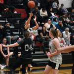 Prince of Wales Cassi Williams hits one of her five three point shots in POWs win over Sitka at the Gold Medal tournament, Tuesday, March 21, in the Juneau-Douglas High School: Yadaa.at Kalé gymnasium.