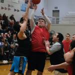 Kakes Brandon Jackson shoots over Angoons John Crossman Jr. and Stephen Johnson during C Bracket action in the Gold Medal Basketball Tournament, Tuesday, March 21, at Juneau-Douglas High School: Yadaa.at Kalé. (Klas Stolpe /For the Juneau Empire)