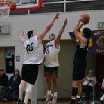 Angoons Kendrick Payton (00) and Aquino Brinson (5) defend a shot by Yakutats Christian Adams during the Gold Medal Baseball Tournament, Tuesday, March 21, at Juneau-Douglas High School: Yadaa.at Kalé. (Klas Stolpe / For the Juneau Empire)