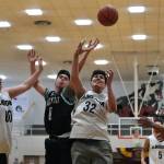 Angoon's Kendrick Payton (00) and Anthony Snow (32) battle for a rebound with Yakutat's Josh James (0) during the Gold Medal tournament, Tuesday, March 21, at Juneau-Douglas High School: Yadaa.at Kalé. (Klas Stolpe / For the Juneau Empire)