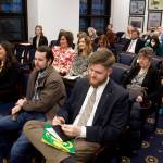 Alaska residents, many of them part of an Americans for Prosperity delegation from outside Juneau, wait to testify during a House Education Committee meeting Tuesday night. Most of the people in the room opposed increasing public education spending, while a majority of residents testifying online spoke in favor of an increase. (Mark Sabbatini / Juneau Empire)