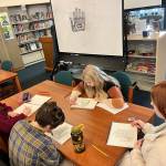 Adeline Harbour, Jade Hicks, Georgia Post and Katelyn Stiles working on a formline hand on the first day. (Courtesy Photo / Carol May)