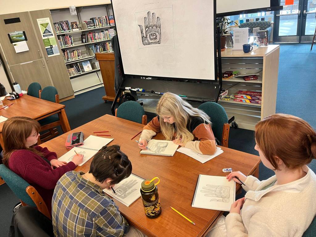 Adeline Harbour, Jade Hicks, Georgia Post and Katelyn Stiles working on a formline hand on the first day. (Courtesy Photo / Carol May)
