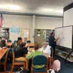 Abel Ryan gives instruction on a killer whale on the last day of lessons. (Courtesy Photo / Carol May)