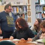 Lucrezia Affatato and Aeryn Locks (left and right) draw while Ella Orsborn(center) receives feedback from Abel Ryan. (Courtesy Photo / David Sheakley-Early)
