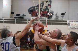 Sitkas Norm Staton (32) fights for the rebound against Kake on Wednesday during an elimination game for the M Bracket in this years Gold Medal basketball tournament. Staton finished the game with 6 points. (Jonson Kuhn / Juneau Empire)
