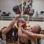 Sitkas Norm Staton (32) fights for the rebound against Kake on Wednesday during an elimination game for the M Bracket in this years Gold Medal basketball tournament. Staton finished the game with 6 points. (Jonson Kuhn / Juneau Empire)