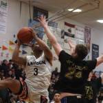 Angoons JJ Nixon (3) puts up a tricky 2-point shot against Metlakatla on Wednesday for an elimination game as part of this years Gold Medal basketball tournament. Nixon finished the game with 12 points. (Jonson Kuhn / Juneau Empire)
