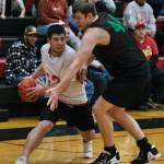 Kakes Tracy Jackson looks to pass around the defense of Haines Tyler Swinton during the Gold Medal tournament, Wednesday, March 22, at Juneau-Douglas High School: Yadaa.at Kalé. (Klas Stolpe/For the Juneau Empire)