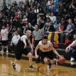 Kakes Simon Friday (40) dribbles around Haines Jordan Baumgartner during the Gold Medal tournament, Wednesday, March 22, at Juneau-Douglas High School: Yadaa.at Kalé. (Klas Stolpe/For the Juneau Empire)