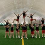 Courtesy Photo / Carlene Nore 
JDHS cheer team competes at this years ASAA State competition in Anchorage at the Alaska Airlines Center.
