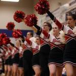 The JDHS cheer team puts paws up for a free throw shot during a Crimson Bears Region V 4A Tournament game. JDHS cheer team is celebrating its third state championship title in a row after competing in Anchorage on Tuesday. From front to back, Angelina Hammons, Summer Lucas, Reuben Grimes, Emily Delgado, Ryan Shattuck, Mila Griffin and Emma Busby. (Ben Hohentstatt / Juneau Empire File)