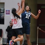 Angoons Tasha Heumann (32) blocks a shot by Kakes Alexis Copsey (20) during Thursday action at the Juneau Lions Club 74th Annual Gold Medal Basketball Tournament at Juneau-Douglas High School: Yadaa.at Kalé. (Klas Stolpe/For the Juneau Empire)