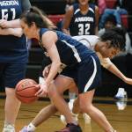 Angoons Carmeleeda Estrada is pressured by Kakes Willow Jackson during Thursday action at the Juneau Lions Club 74th Annual Gold Medal Basketball Tournament at Juneau-Douglas High School: Yadaa.at Kalé. (Klas Stolpe/For the Juneau Empire)