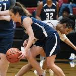 Angoon's Carmeleeda Estrada is pressured by Kake's Willow Jackson during Thursday action at the Juneau Lions Club 74th Annual Gold Medal Basketball Tournament at Juneau-Douglas High School: Yadaa.at Kalé. (Klas Stolpe/For the Juneau Empire)