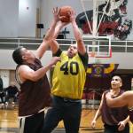 Hoonahs Albert Hinchman defends as hot by Sitkas Patrick Miller (40) as Hoonahs Andy Gray, Louie White Jr. and Joe Coronell look on during Thursday action at the Juneau Lions Club 74th Gold Medal Basketball Tournament at Juneau-Douglas High School: Yadaa.at Kalé. (Klas Stolpe/For the Juneau Empire)