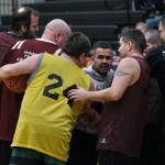Sitkas Steve Edenshaw (24) infiltrates the Hoonah huddle prior to tip off of their game during Thursday action at the Juneau Lions Club 74th Gold Medal Basketball Tournament at Juneau-Douglas High School: Yadaa.at Kalé. (Klas Stolpe/For the Juneau Empire)