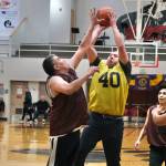 Hoonah's Albert Hinchman defends as hot by Sitka's Patrick Miller (40) as Hoonah's Andy Gray, Louie White Jr. and Joe Coronell look on during Thursday action at the Juneau Lions Club 74th Annual Gold Medal Basketball Tournament at Juneau-Douglas High School: Yadaa.at Kalé. (Klas Stolpe/For the Juneau Empire)