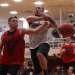 Hydaburgs Vinnie Edenshaw dislodges the ball from the grasp of Juneaus Riley Olsen late in a Juneau B Bracket win. The Thursday night victory secured a spot for Juneau in the Gold Medal Basketball Tournaments championship game. (Ben Hohenstatt / Juneau Empire)