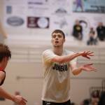 Kaleb Tompkins throws a no-look pass in the second half of a Juneau-Hydaburg B Bracket game on the fifth day of the Gold Medal Basketball Tournament.