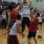 Juneaus Matt Seymour shoots over Hydaburgs Claude Young (7) and Vinnie Edenshaw (8) during Thursdays B Bracket semifinal in the Juneau Lions Club 74th Annual Gold Medal Basketball Tournament at Juneau-Douglas High School: Yadaa.at Kalé. (Klas Stolpe/For the Juneau Empire)