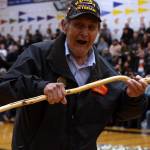 Marvin Kadake, a Korea War veteran from Kake, dances ahead of Thursdays B Bracket Gold Medal Basketball Tournament game between Juneau and Hydaburg. (Ben Hohenstatt / Juneau Empire)