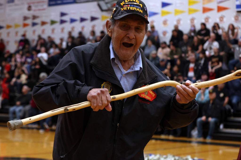 Marvin Kadake, a Korea War veteran from Kake, dances ahead of Thursdays B Bracket Gold Medal Basketball Tournament game between Juneau and Hydaburg. (Ben Hohenstatt / Juneau Empire)