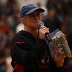 Molly Box, interim principal for Juneau School Districts Tlingit Culture Language and Literacy Program, accepts over $2,500 that was raised prior to Thursday nights B Bracket game. (Ben Hohenstatt / Juneau Empire)