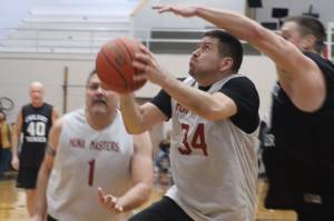 Hoonahs Kamal Lindoff (34) knocks down a layup on Friday against Klukwan in the M bracket Gold Medal Basketball Tournament at JDHS. Lindoff finished the game with 12 points. (Jonson Kuhn / Juneau Empire)