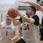 Hoonahs Kamal Lindoff (34) knocks down a layup on Friday against Klukwan in the M bracket Gold Medal Basketball Tournament at JDHS. Lindoff finished the game with 12 points. (Jonson Kuhn / Juneau Empire)