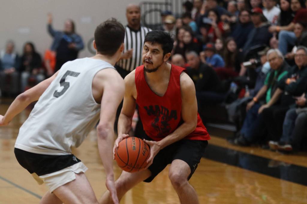 Hydaburgs Darren Edenshaw looks to take a 3-point shot against Juneau Saturday night for the final game of this years Gold Medal Basketball Tournament. Edenshaw would finish with the second most points on his team, just under his brother Vinny with 21. Edenshaw also earned all-tournament honors at the award ceremony following the game. (Jonson Kuhn / Juneau Empire)