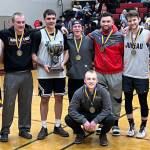 Juneaus Gold Medal Basketball Tournament B Bracket team poses for a group photo after winning the B bracket championship game in this years Gold Medal Basketball Tournament Saturday night at JDHS. (Jonson Kuhn / Juneau Empire)