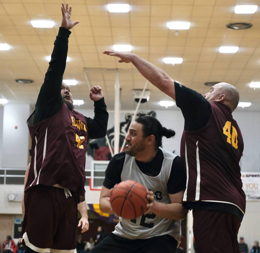 Klukwans Jeffrey Klanot (42) and Stuart Dewitt (40) during the C Bracket Championship game of the Gold Medal Basketball Tournament, Saturday, March 25, at Juneau-Douglas High School: Yadaa.at Kalé. (Klas Stolpe/For the Juneau Empire)