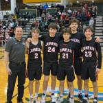 JDHS senior boys with coach Robert Casperson, left to right, Nelson Bodhi, Kai Hargrave, Caden Masdeg, Orion Dybdahl and Joseph Aline, pose for a photo at the ASAA state competition in Anchorage on Saturday before the championship game against Dimond High School. The Crimson Bears would take sixth place overall. (Courtesy Photo / Robert Casperson)